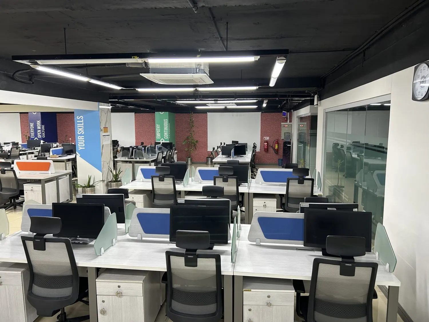 A bay of fixed desks