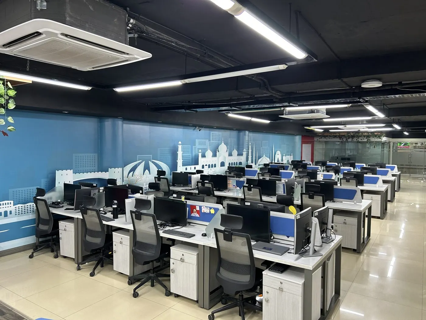 The open floor, three runs of desks